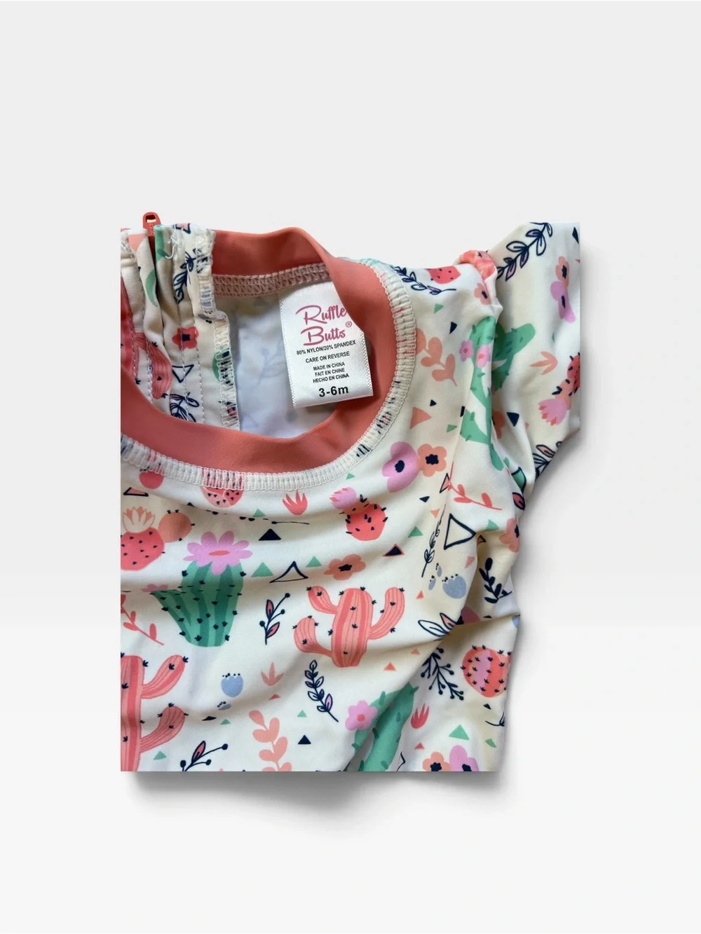 Ruffle Butts White Cactus Print Long-Sleeve One-Piece with Coral Trim
